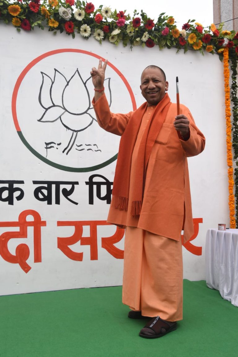 CM Yogi pens ‘Ek Baar Phir Modi Sarkar’ slogan on the wall, also draws party symbol